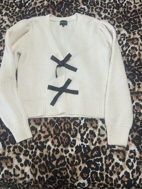 Majorelle Cream V-Neck Sweater with Black Bow Accents